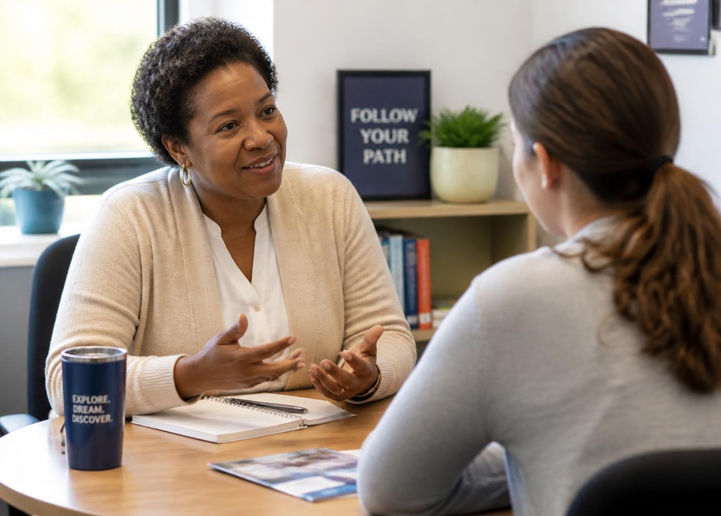 A Career Counselor talking with a student across a table